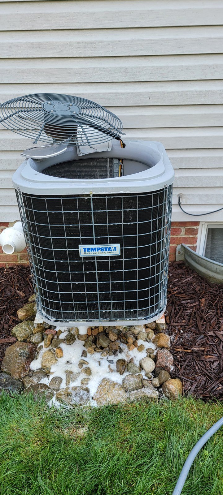 Outdoor air conditioner coil cleaning